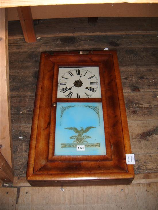 A late 19th century American walnut wall clock